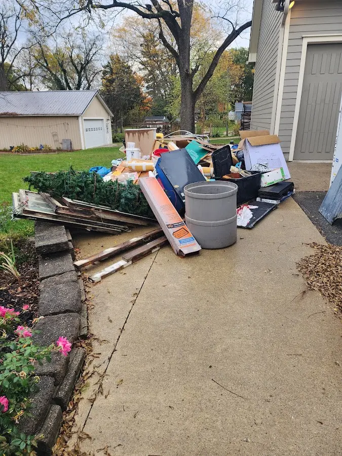 Dumpster being loaded with debris for Demolition Dumpster Rental in Mineral Ridge